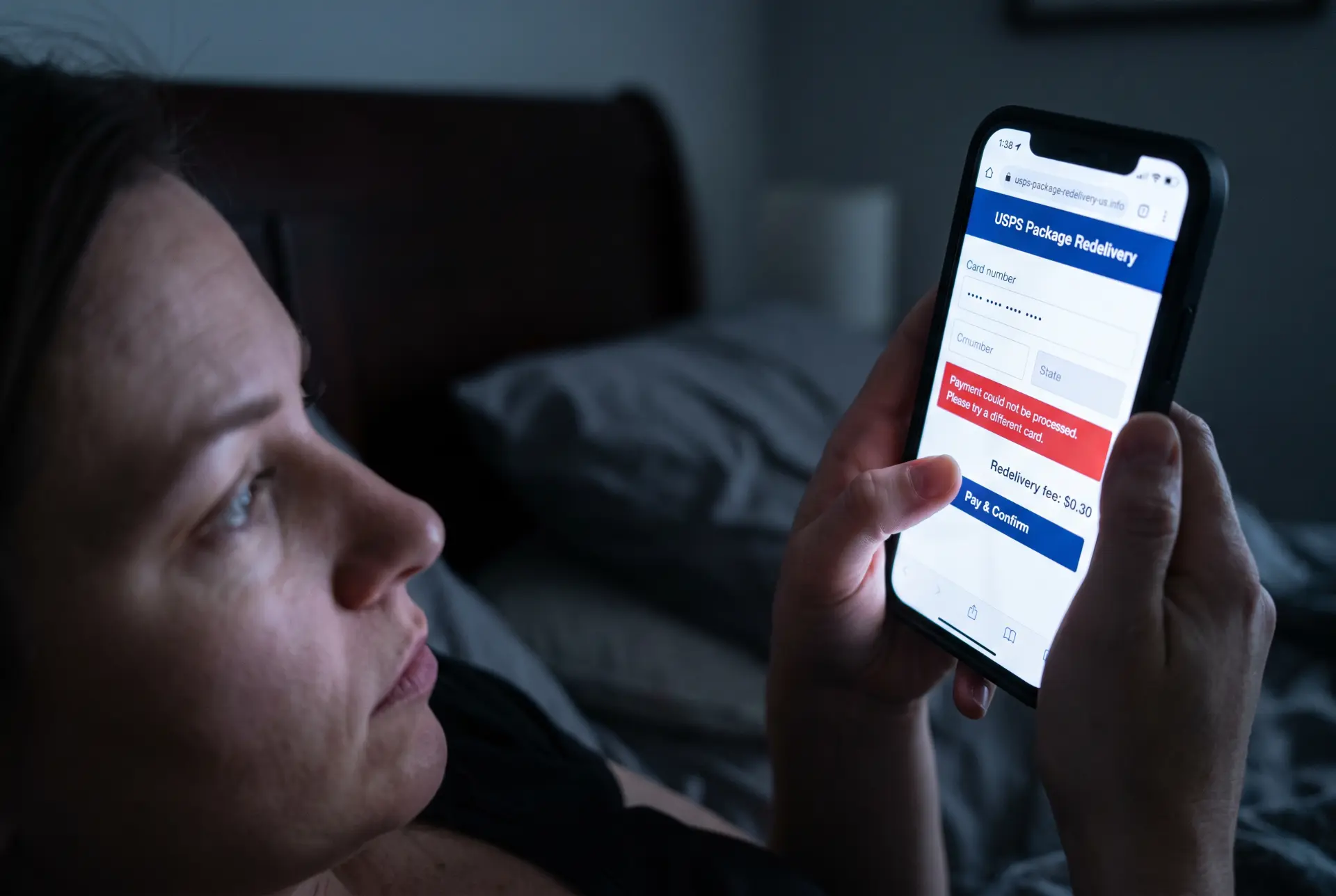Fake USPS package redelivery payment page on a phone showing a card field and a 'payment could not be processed' error